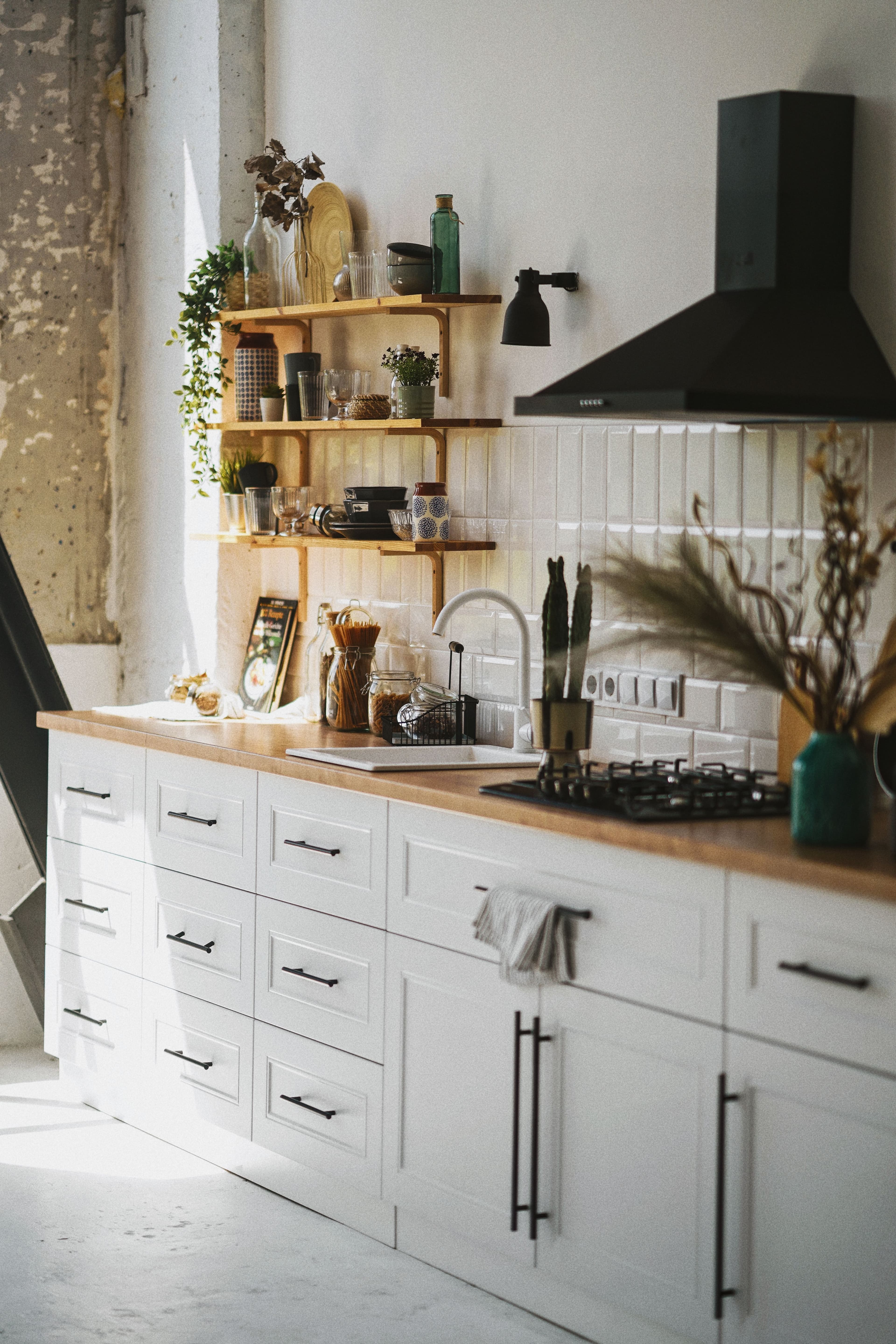 Warm, light-filled kitchen with open shelving