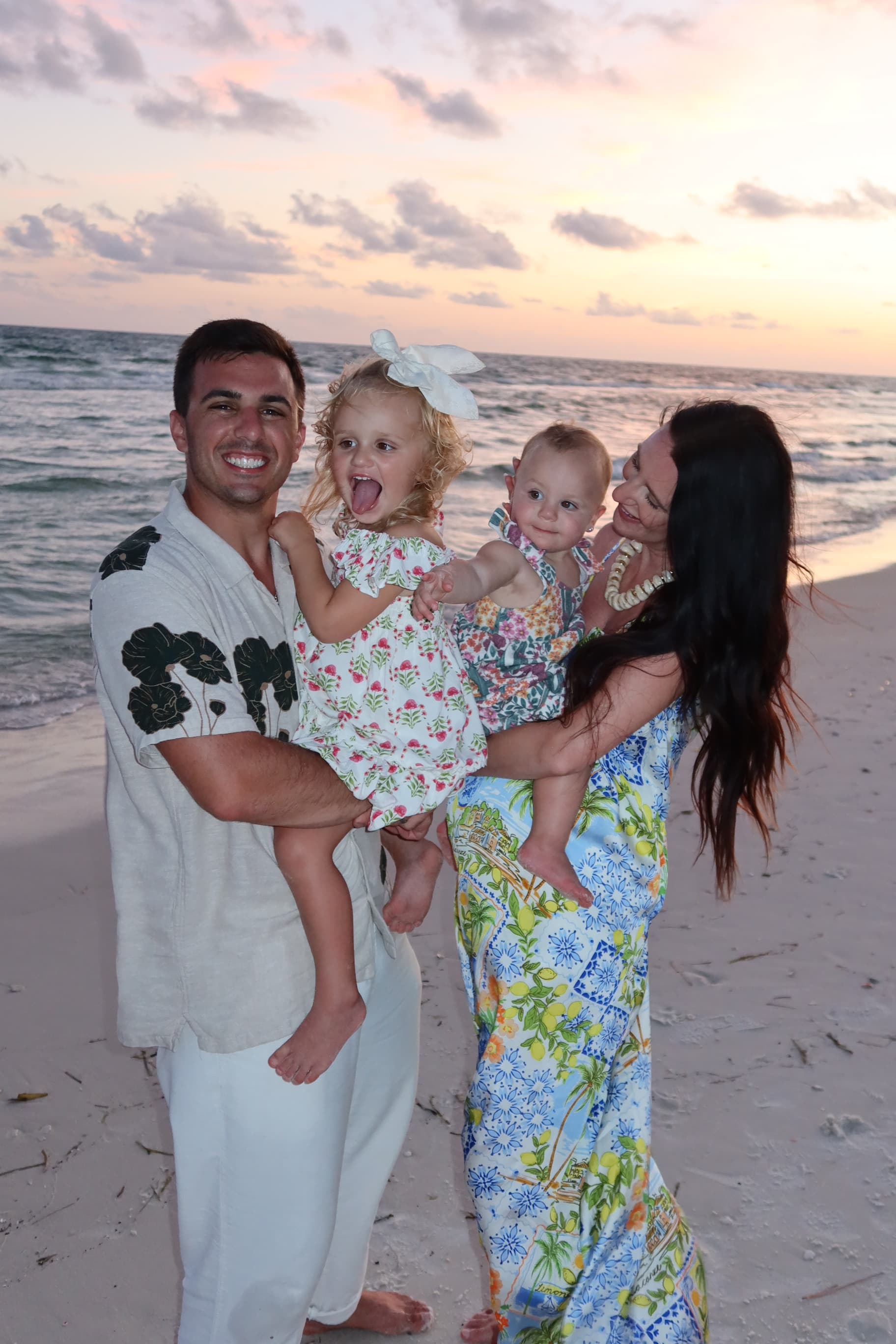 Gianna Nuccio with her husband and two daughters at the beach
